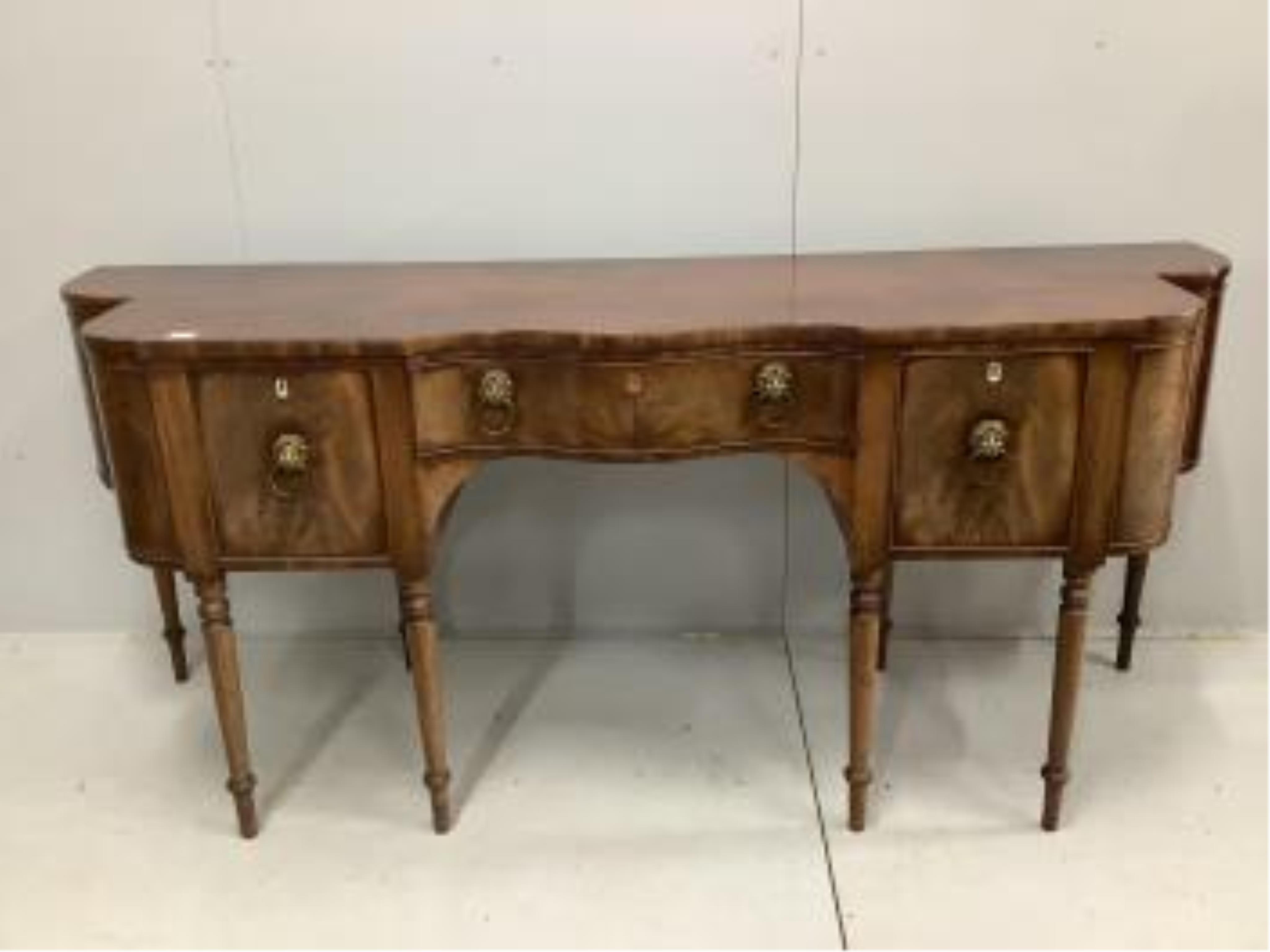 A late George IV mahogany serpentine front sideboard, width 226cm, depth 67cm, height 96cm. Condition - fair